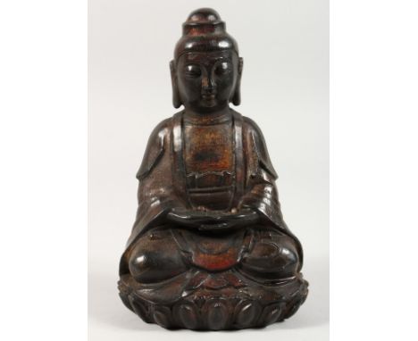 A CHINESE BRONZE SEATED GOD. 8ins high.