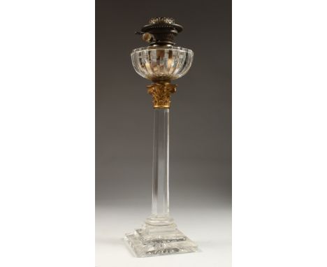 A GOOD VICTORIAN GLASS OIL LAMP on a stamped square base. 23ins high.