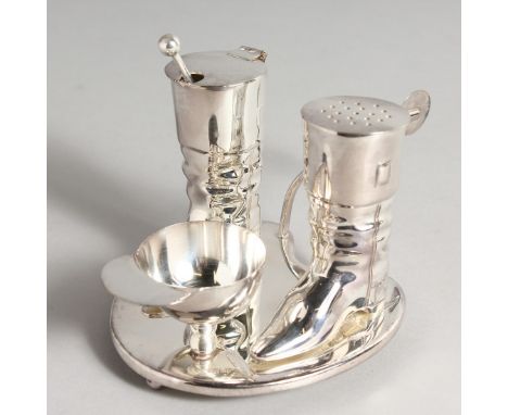 A SILVER PLATE RIDING BOOT CRUET.