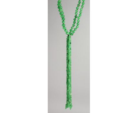 A DOUBLE ROW OF JADE BEADS with several rows of small beads with gold clasp.