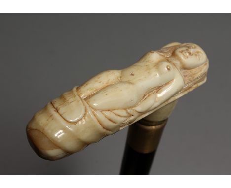 A WALKING STICK with bone handle, NUDE. 33ins long.