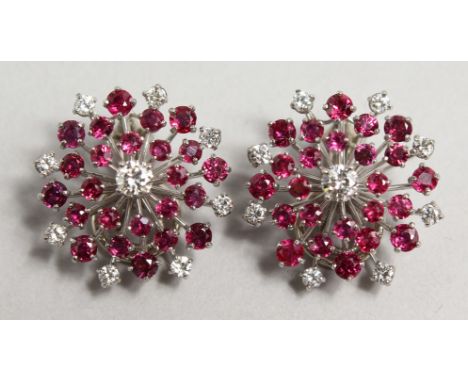 A GOOD PAIR OF 18CT GOLD, DIAMOND AND RUBY STARBURST EARRINGS.