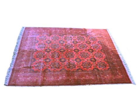 A GOOD PERSIAN CARPET, red ground with a design of large floral palmettes, within a similar border. 11ft 3ins x 8ft 4ins.