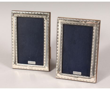 A PAIR OF SILVER UPRIGHT PHOTOGRAPH FRAMES. Bead Edge design. 6ins x 4ins.