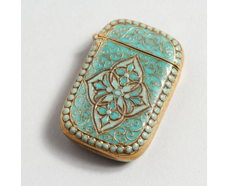 A BRASS AND ENAMEL VESTA.