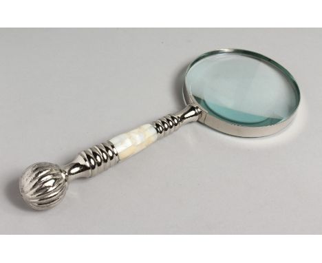 A NOVELTY MAGNIFYING GLASS with mother-of-pearl and chrome handle.
