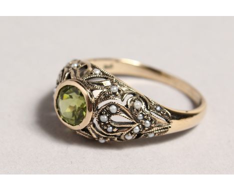A 9CT GOLD, PERIDOT AND PEARL RING.