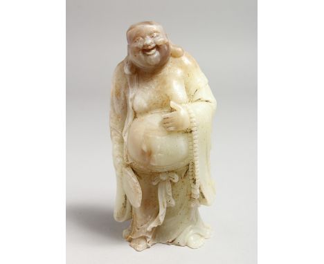 A CHINESE CARVED JADE FIGURE. 7ins high.