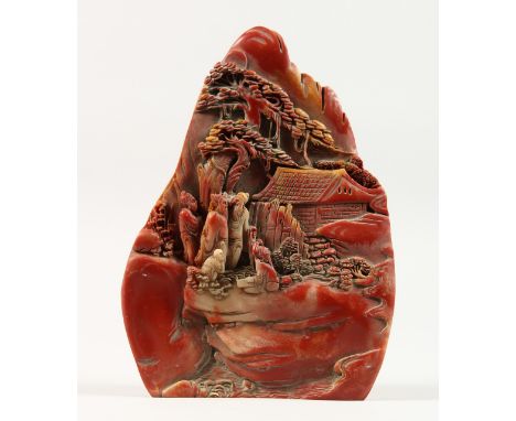A CHINESE CARVED HARDSTONE BOULDER. 9ins high.