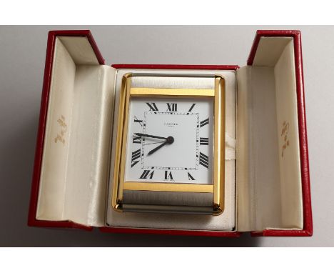 A VERY GOOD CARTIER PARIS TRAVELLING CLOCK in a red Cartier case, No. 750503920.