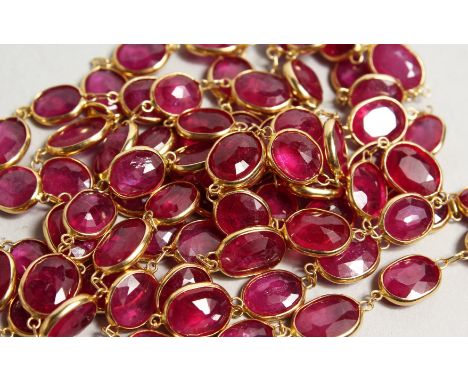 A VERY GOOD GOLD, RUBY SET LONG CHAIN.