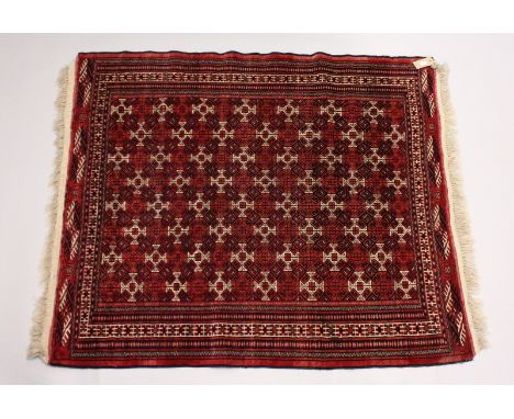 A TURKOMAN YAMUD CARPET, red ground with allover geometric design. 5ft 10ins x 4ft 8ins.