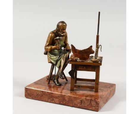 A VIENNA BRONZE COBBLER on a marble base. 5.25ins.