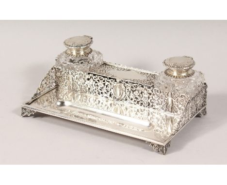 A GOOD VICTORIAN SILVER PIERCED TWO BOTTLE INKSTAND. London 1891. Maker: George Fox. 7.75ins long.