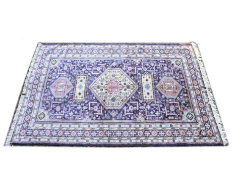 A PERSIAN CARPET, blue ground with a central large cream ground medallion. 8ft 6ins x 6ft 0ins.