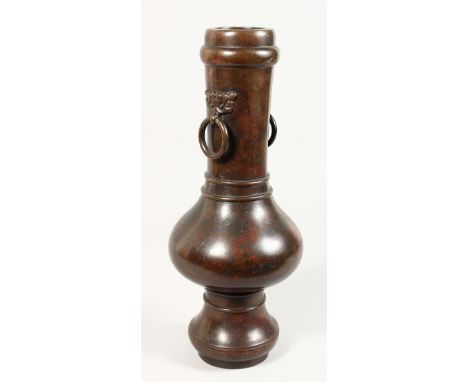 A CHINESE BRONZE VASE with ring handles. 16ins high.