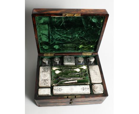 A SUPERB WILLIAM IV COROMANDEL LADIES' VANITY BOX, OPENING TO REVEAL A MIRROR IN THE LID, ten silver top pots, also filled wi