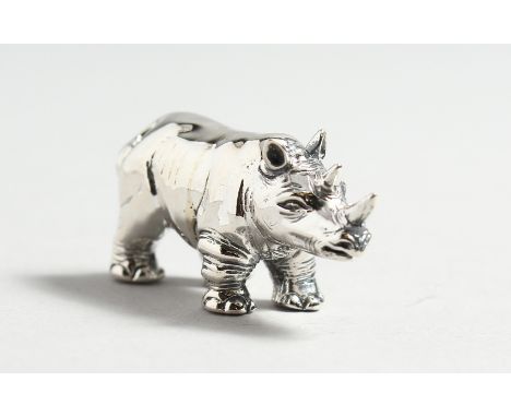 A CAST SILVER RHINO.
