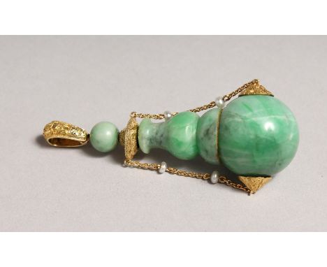 A SUPERB GOLD MOUNTED JADE PERFUME BOTTLE with gold chain, seed pearls, gold stopper and pendant. 2.75ins long.