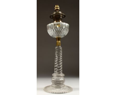 A GOOD VICTORIAN GLASS OIL LAMP on a circular base. 23ins high