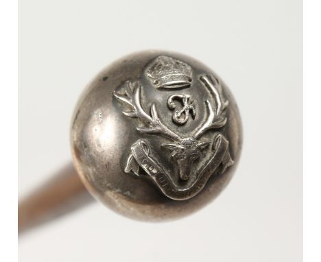 A SILVER TOP CANE with military crest. 29ns long.