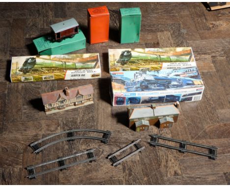 Three large boxes of railway track, railway accessories, a quantity of boxed unused Hornby tin plate carriages and engines an