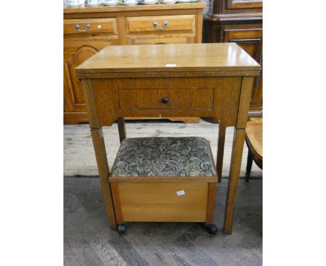 A Viking electric table model sewing machine and an oak framed stool with upholstered top 