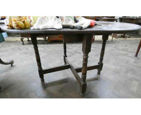 An oval oak gate legged style dining table 2'6 wide 