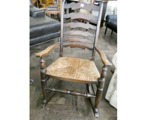 A Lancashire style ladder back rocking chair with rushed seat 