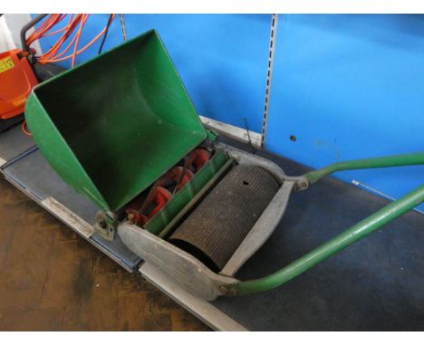 A push along cylinder lawn mower with roller 