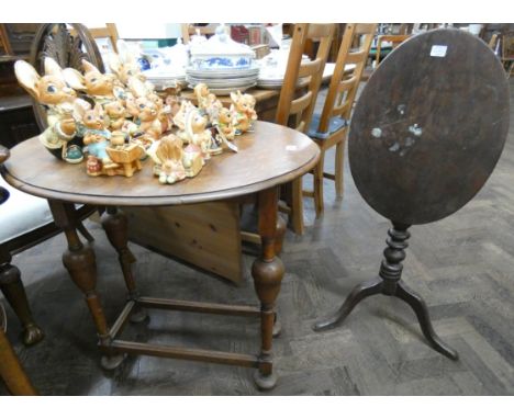 An oval gate legged table on bobbin turned legs, 2' wide and an oval mahogany snap top occasional table 