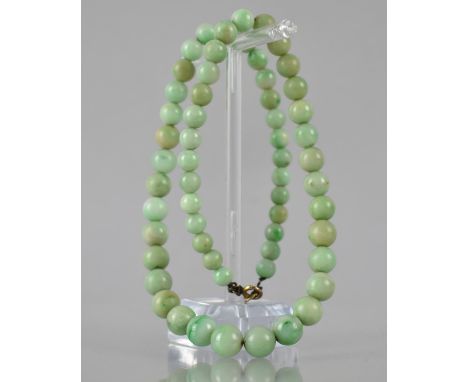 A String of Graduated Jade Beads, Largest Spherical Bead Measuring 9.5mm Diameter, Varying Shades on a Metal Thread and with 