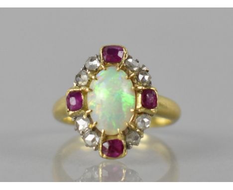 An Opal, Ruby and Diamond Mixed Metal Dress Ring, Central Oval Opal Cabochon Measuring 10.5 by 7mm Set in Twelve Yellow Metal