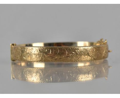 A 9ct Gold Hinged Bangle, Front Plaque Engraved with Scrolling Decoration, Marked for Birmingham 1992 with Makers Mark for Sm