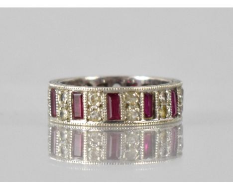 An Elizabeth II 9ct White Gold, Ruby and White Sapphire Eternity Ring, Eleven Baguette Cut Rubies Measuring 3.5x2mm Approx, M