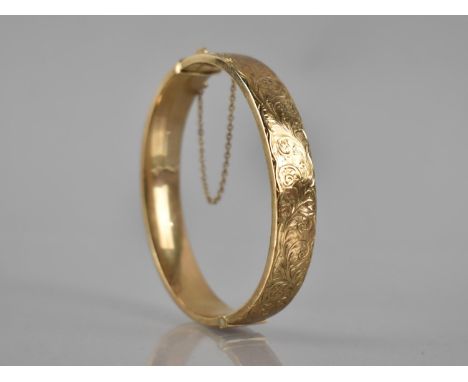 A Vintage 9ct Gold Hinged Bangle, Engraved Scrolling Foliate Decoration to Front Panel, 13.7gms, Internal Dimensions 59mm by 