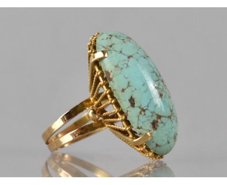 An Egyptian 18ct Gold and Turquoise Ring, Large Elongated Oval Cabochon Turquoise Measuring 29mm by 13mm, Four Prong Setting 