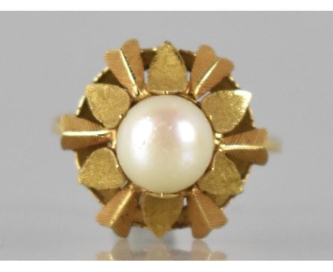 An Eastern Gold Metal and Pearl Ladies Dress Ring, Raised Pearl Measuring 7mm Diameter and Set in Starburst Design with Textu