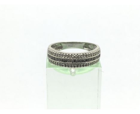 A 9ct white gold half eternity three row diamond ring, approx. 40ct, approx 2.5g and approx size L.