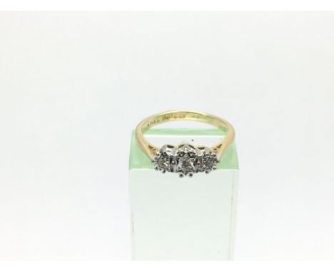 An 18ct gold three stone diamond ring, approx.15ct, approx 2.7g and approx size K.