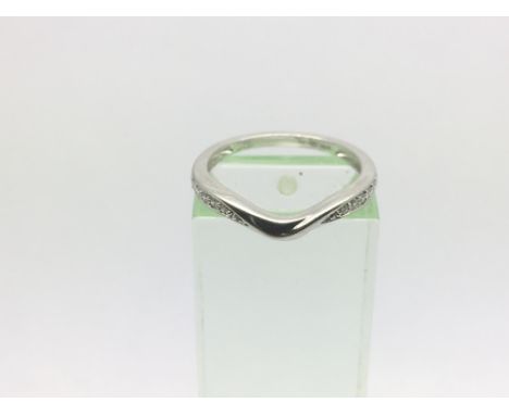 A platinum 10 point diamond wishbone ring, approx 3.2g and approx size M.