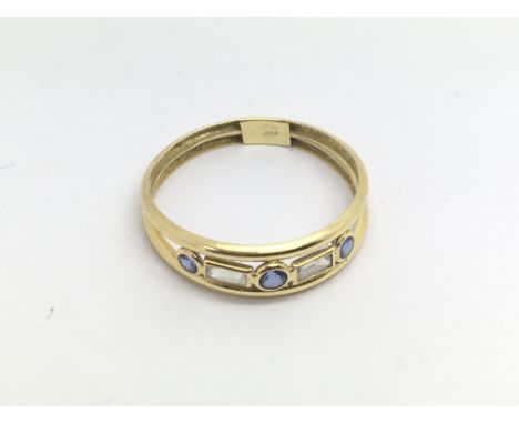 An 18ct gold ring set with sapphires and CZs, approx 1.1g and approx size O-P.