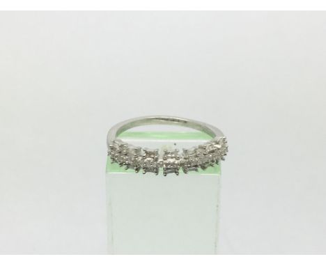 A silver and diamond half eternity ring, approx 2.2g and approx size O.