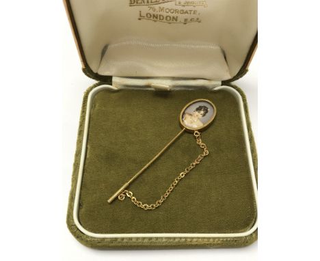 A miniature 18ct gold stick pin set with a cameo and diamonds.