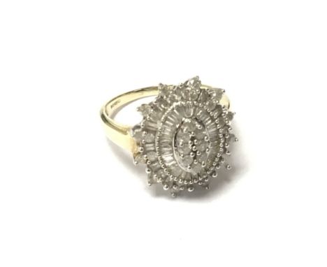 A Quality 9carat gold ring set with a good pattern of brilliant cut round and baguette diamonds. Ring size N-O