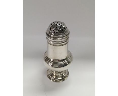 A Georgian silver condiment and a small silver pepper grinder.