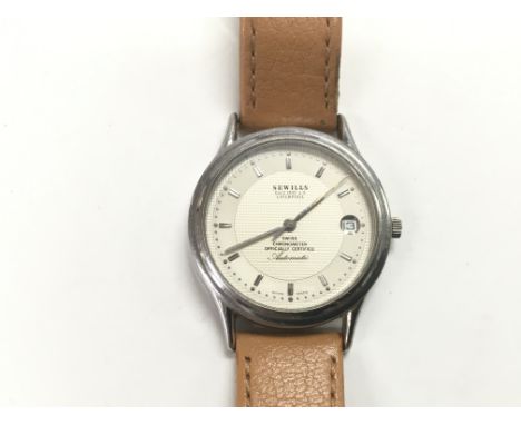 A gents Sewills automatic chronograph watch with baton numerals and date aperture.