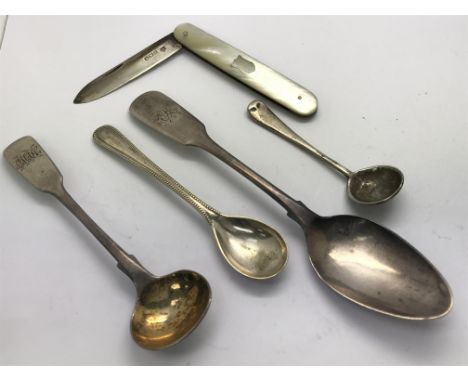 Four antique sterling silver spoons and a small folding knife with silver blade and a mother of Pearl handle, circa 1901. The