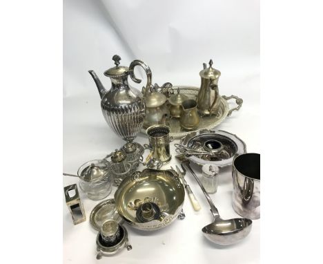 A large collection of silver plated items including a large tray, a serving spoon, a large coffee pot and many other oddments