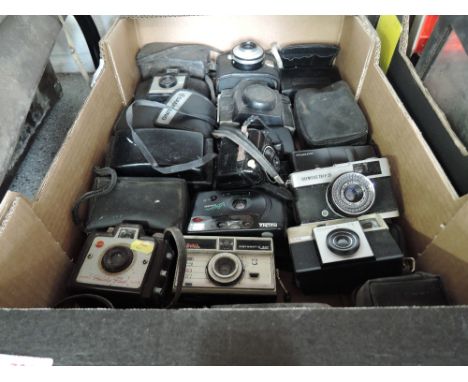 A box of mainly Instamatic cameras